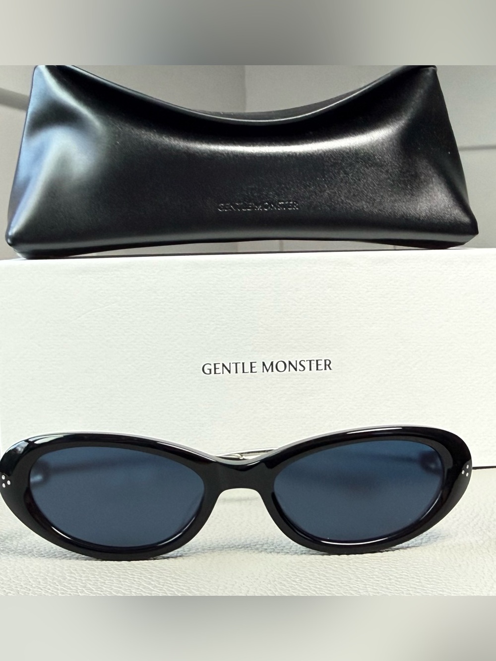 GENTLE MONSTER Black Frame Sunglasses with Blue Lenses
